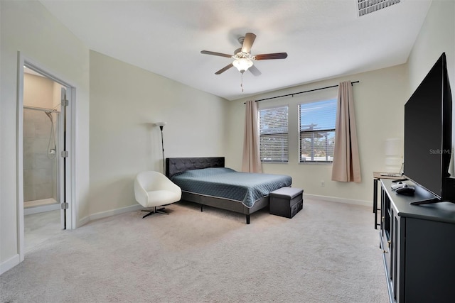 carpeted bedroom with ceiling fan and ensuite bathroom