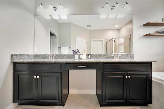 bathroom with tile patterned floors, vanity, and a shower with shower door