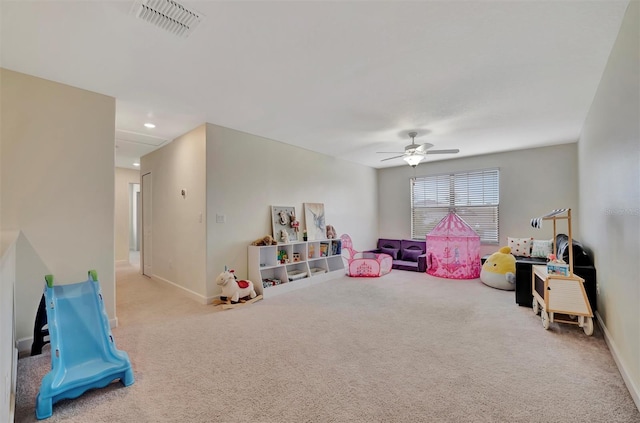 rec room featuring ceiling fan and light colored carpet