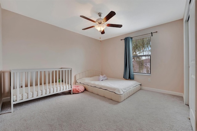 bedroom with ceiling fan and light colored carpet