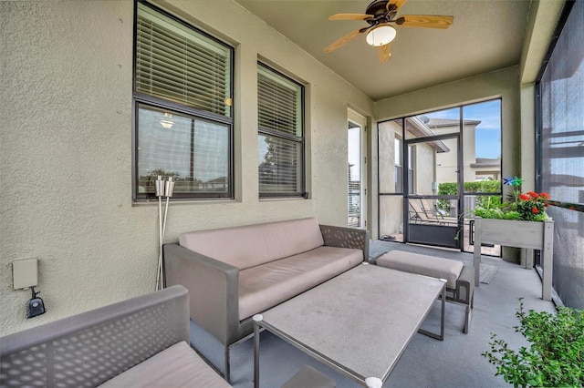 sunroom featuring ceiling fan