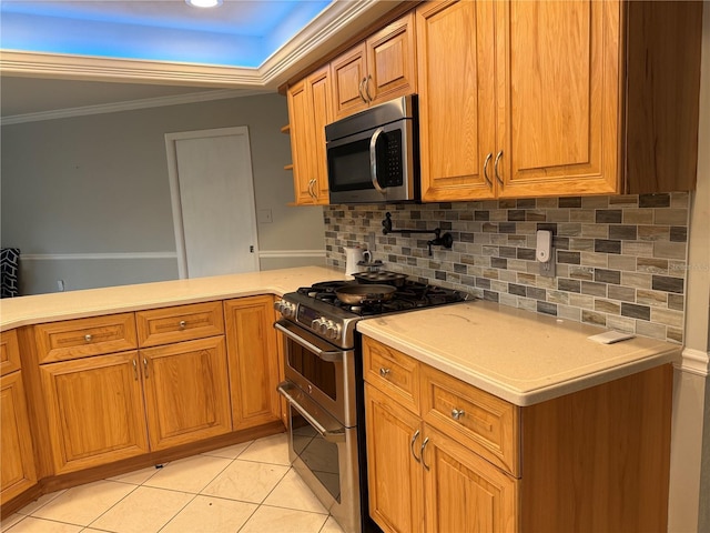 kitchen featuring tasteful backsplash, crown molding, stainless steel appliances, and light tile patterned flooring