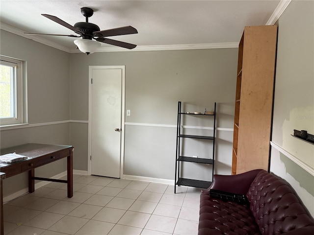 interior space with ceiling fan and crown molding