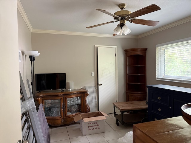 interior space with ceiling fan, light tile patterned floors, and ornamental molding