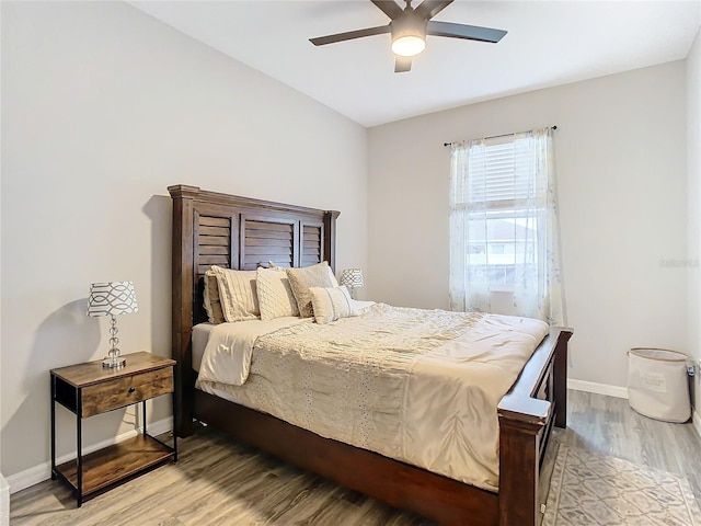 bedroom featuring hardwood / wood-style floors and ceiling fan