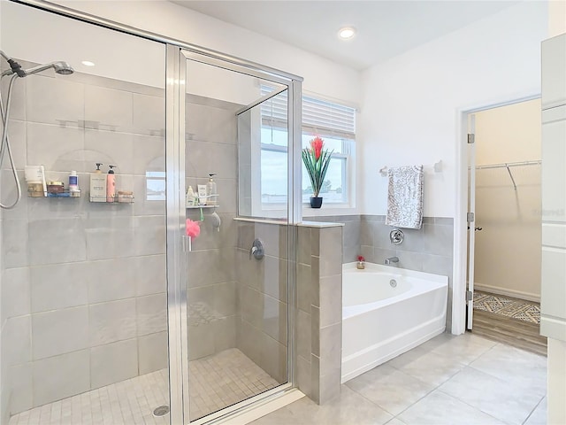 bathroom with tile patterned flooring and plus walk in shower