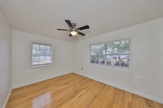 spare room featuring ceiling fan and light hardwood / wood-style flooring