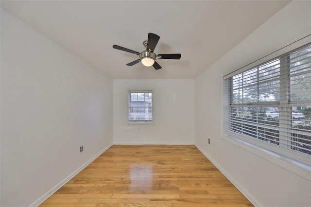 empty room featuring ceiling fan and light wood-type flooring