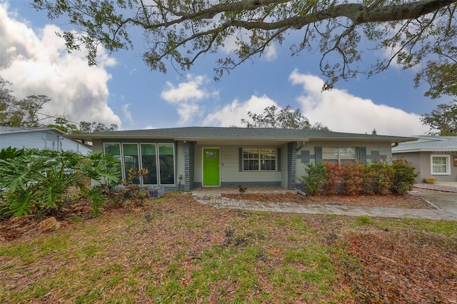 ranch-style home with a front yard