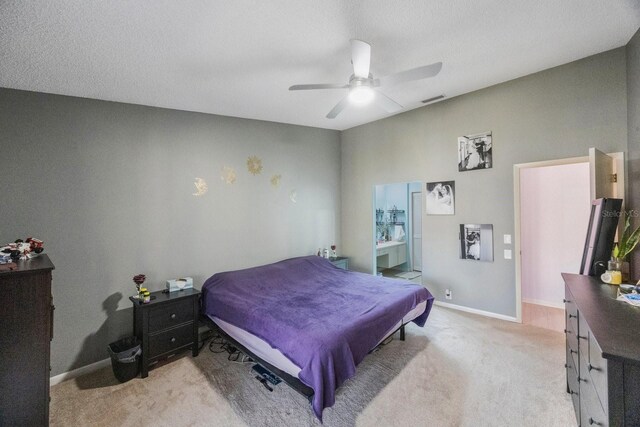 bedroom with ceiling fan and light carpet