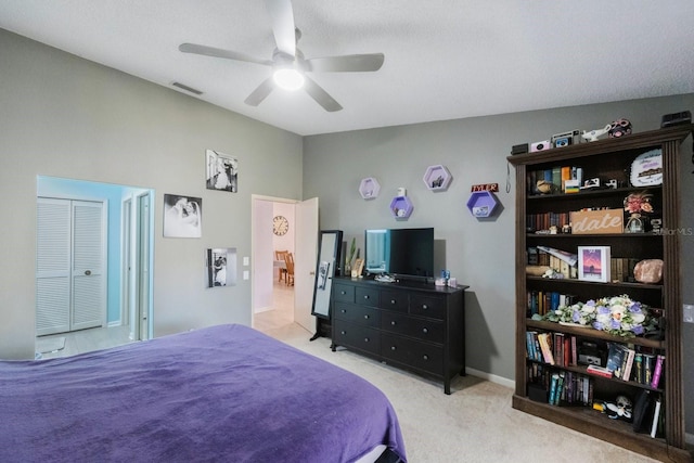 bedroom with ceiling fan and light carpet