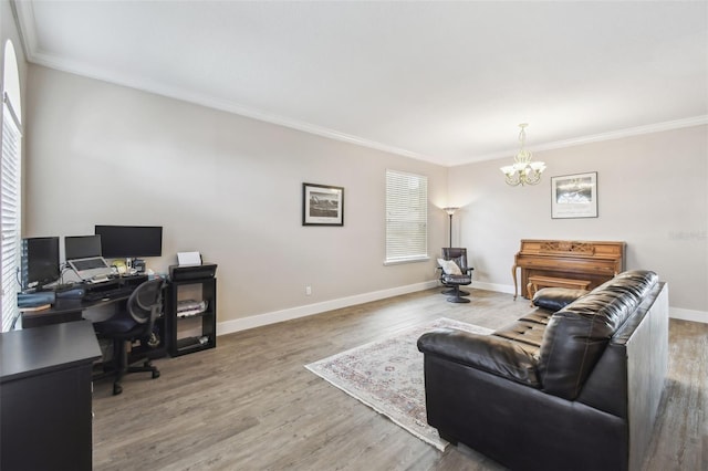 office space featuring hardwood / wood-style flooring, ornamental molding, and a chandelier