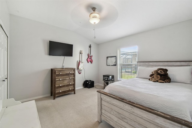 carpeted bedroom with ceiling fan and lofted ceiling