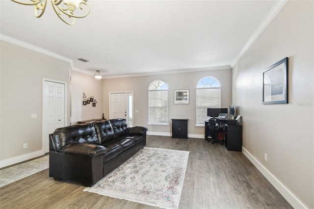 living room with crown molding and hardwood / wood-style flooring