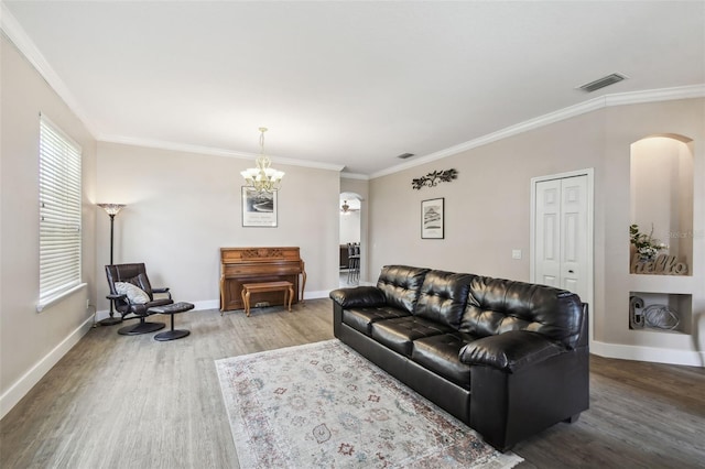 living room featuring crown molding and hardwood / wood-style floors