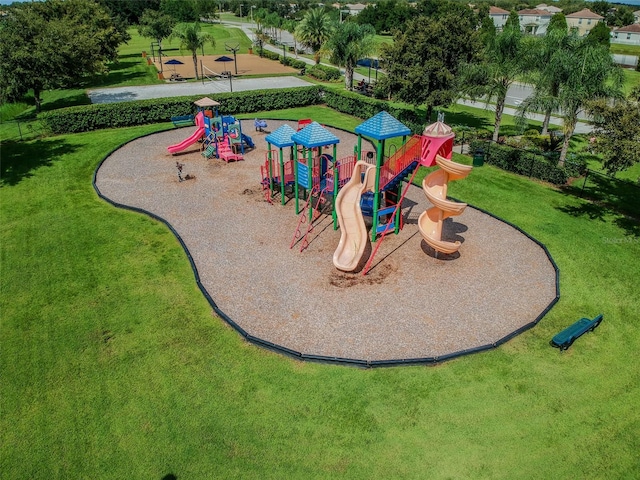 exterior space featuring a playground and a lawn