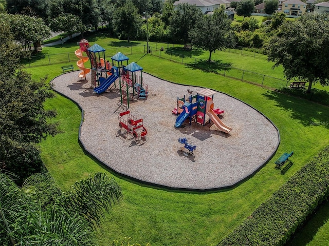 view of jungle gym featuring a lawn