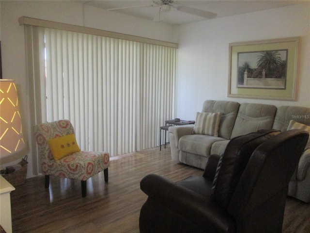 living room featuring ceiling fan and hardwood / wood-style floors