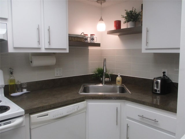 kitchen with backsplash, sink, white appliances, white cabinetry, and hanging light fixtures