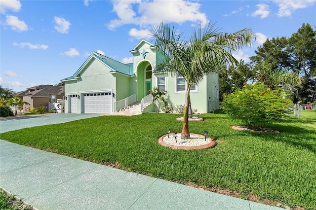 view of front of home featuring a front lawn and a garage