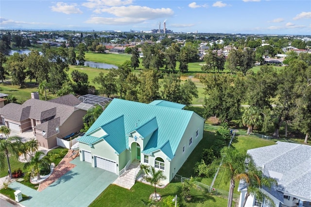 birds eye view of property featuring a water view