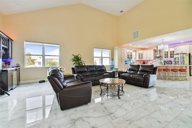 living room with a high ceiling