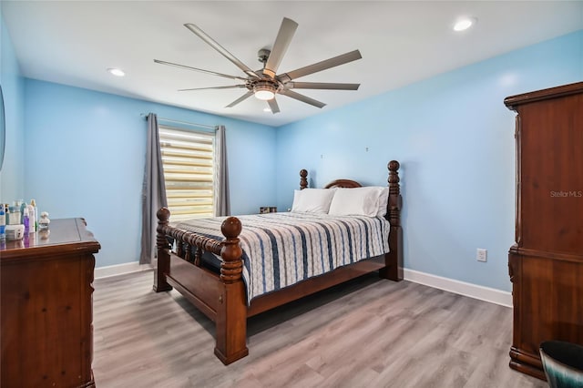 bedroom featuring ceiling fan and light hardwood / wood-style floors