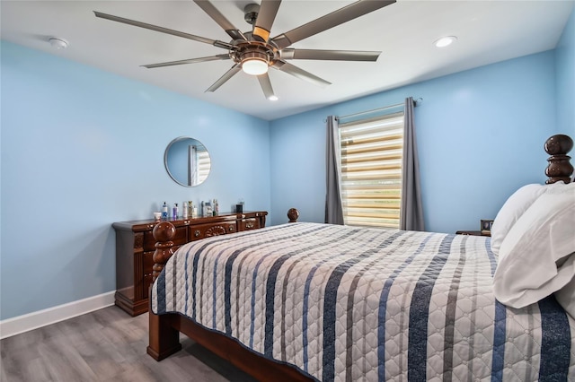 bedroom featuring ceiling fan and hardwood / wood-style flooring