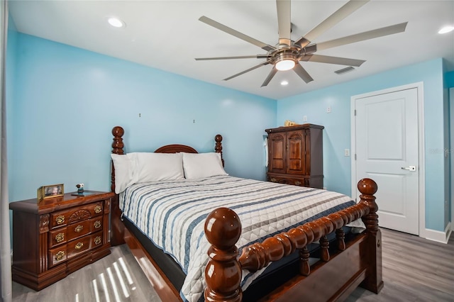 bedroom featuring ceiling fan and hardwood / wood-style flooring