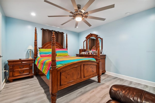 bedroom with ceiling fan and light hardwood / wood-style flooring