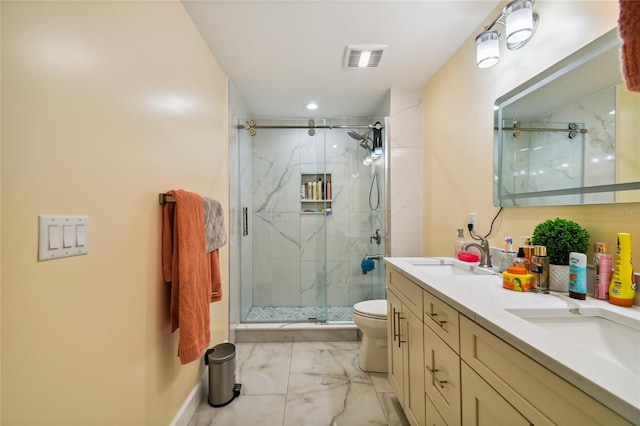 bathroom with walk in shower, vanity, and toilet