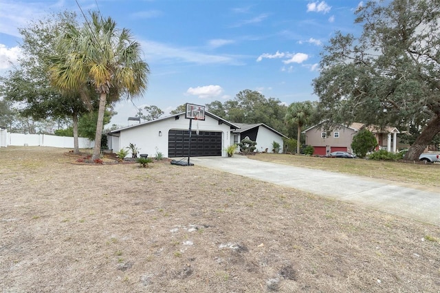 view of front of home featuring a garage and a front yard