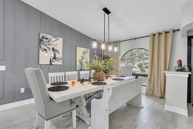 dining space with light hardwood / wood-style flooring