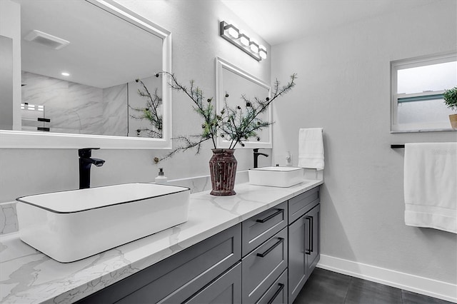 bathroom featuring walk in shower and vanity