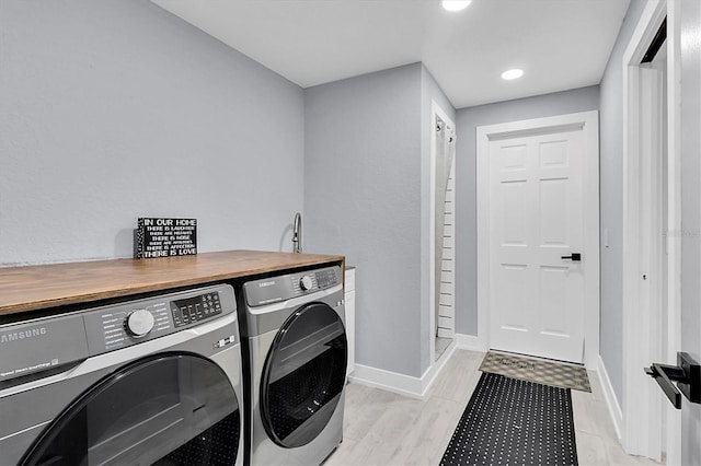 laundry room with washing machine and clothes dryer