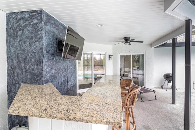 view of patio featuring ceiling fan