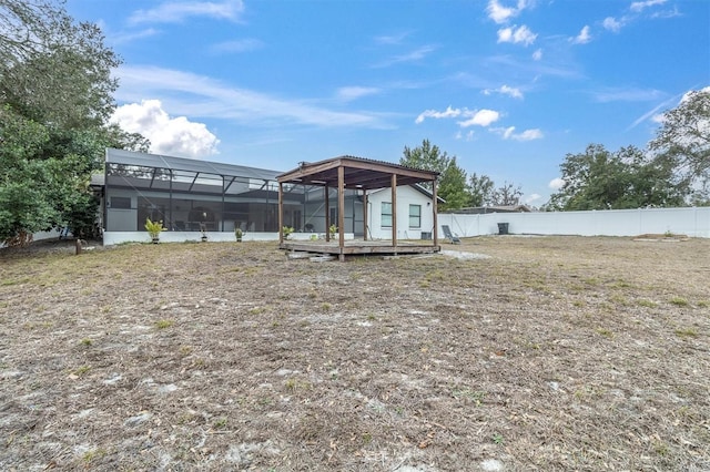 back of property with glass enclosure