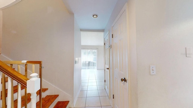 hallway featuring light tile patterned flooring