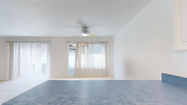 unfurnished room with ceiling fan