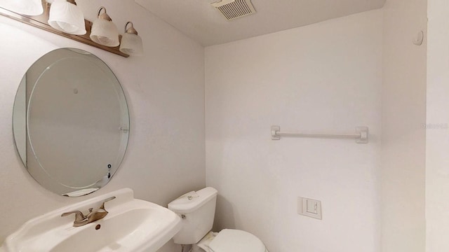 bathroom with sink and toilet