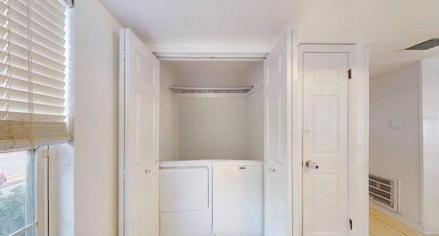 closet featuring separate washer and dryer