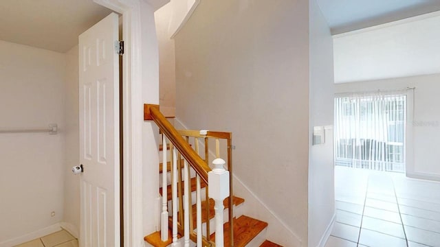 stairs featuring tile patterned flooring