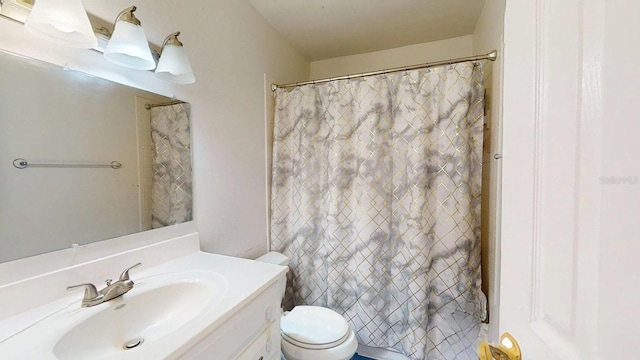 bathroom with vanity, toilet, and a shower with shower curtain