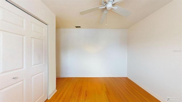 unfurnished room featuring ceiling fan and light wood-type flooring