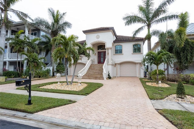 mediterranean / spanish-style home featuring a garage