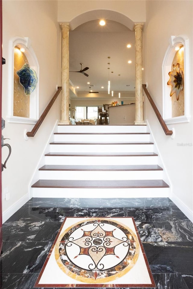 staircase with ornate columns