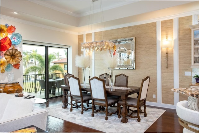 dining space featuring crown molding and wood-type flooring
