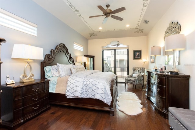 bedroom featuring dark hardwood / wood-style floors, access to outside, and ceiling fan