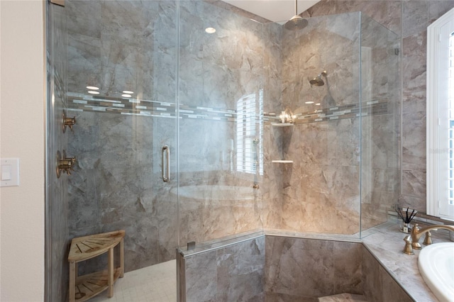 bathroom with sink and separate shower and tub