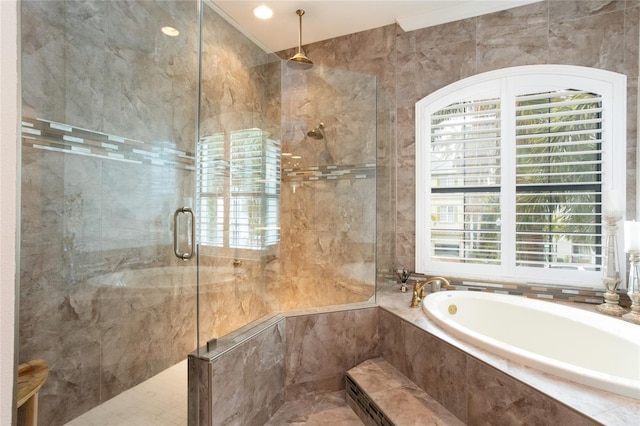bathroom with shower with separate bathtub